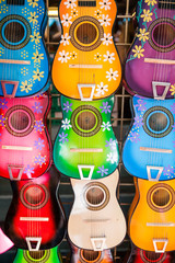 Colorful traditional mexican guitars on market. Great for
