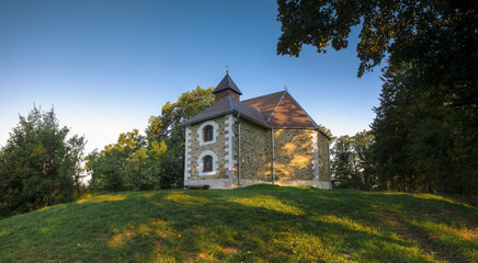 Fototapeta na wymiar Beautiful small church in the woods 