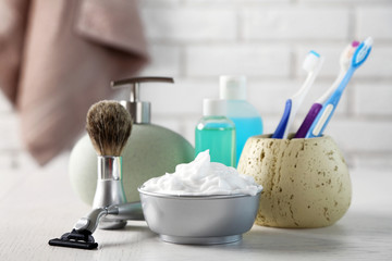 Male luxury shaving kit on shelf, on bricks wall background