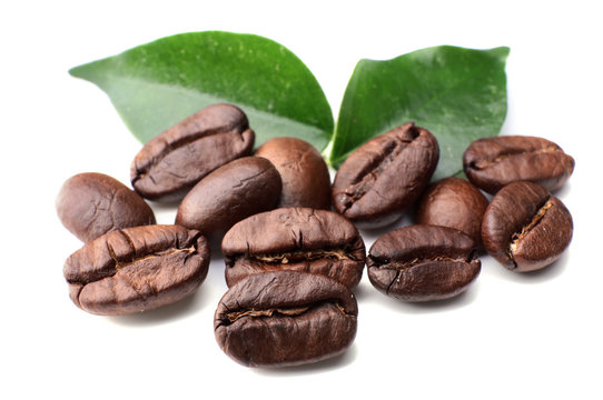 Coffee beans with leaves isolated on white