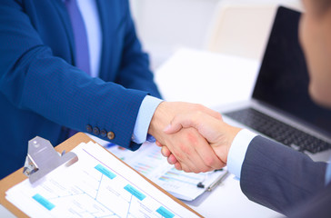 Business people shaking hands, finishing up a meeting