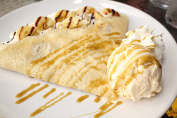 Crepes with banana and ice cream