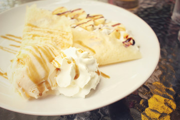 Crepes with banana and ice cream