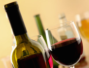 glass of red wine and the wine bottle.