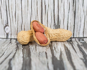 Peanut or ground nut over wooden background