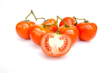 Tomatoes. Whole and a half isolated on white