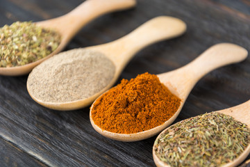 Spices and herbs in  bowls.