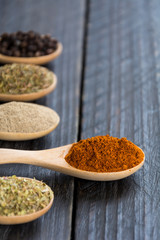 Spices and herbs in  bowls.