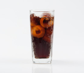 Glass of cola with ice isolated on white.