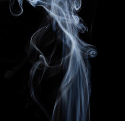 Fototapeta premium Abstract white floating smoke on dark background