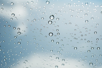 Water drops on glass ,Movement of water drop on glass ,Out of focus water drop movement background for presentation and business