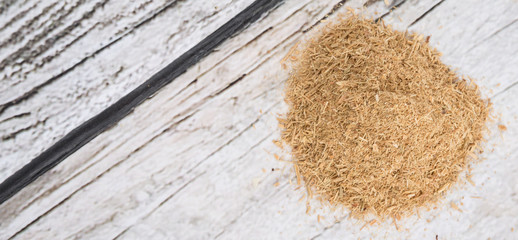 Lemongrass powder over wooden background