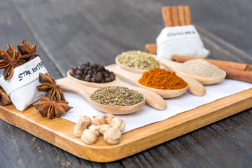 Spices and herbs in  bowls.