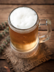 glass of beer on wooden table