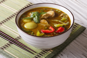 Thai cuisine: green curry chicken close-up. horizontal
