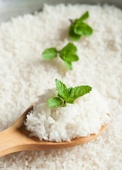  rice garnished with mint and wooden spoon