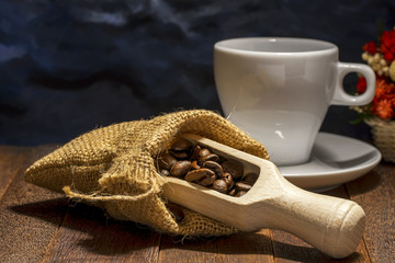 Still life of coffee been in wooden scoop