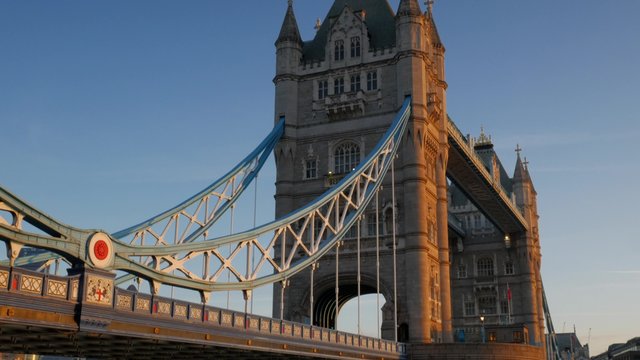 Tilt up Tower Bridge on a stunning clear autumn morning with beautiful sunlight. Original footage is 4K