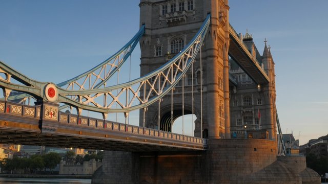 Tilt down Tower Bridge to the River Thames on a stunning clear autumn morning with beautiful sunlight. Original footage is 4K
