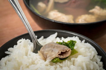 Close up Ma-Li rice with Chitterlings by Pork soup made from pork bone and east herbs.
