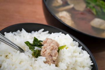 Close up Ma-Li rice with Minced pork by Pork soup made from pork bone and east herbs.