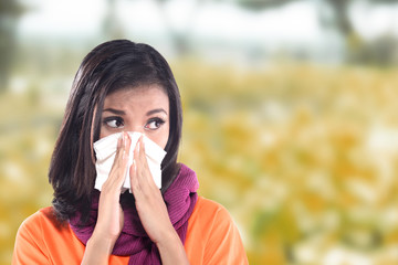 Young sick woman having cold