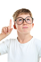 Portrait of happy little boy with eyeglasses on white background