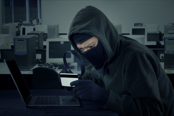 Robber stealing credit card information