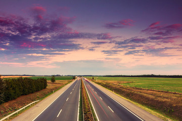 Cars speeding on a highway