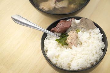 Pork soup made from pork bone with Ma-Li rice.breakfast or diner Thai food 