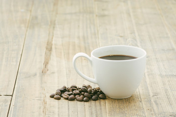 White coffee cup and bean