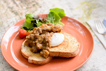 Beef in curry and benedict egg sanwich
