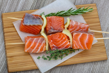 Raw salmon skewers