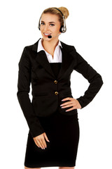 Happy young businesswoman with headset