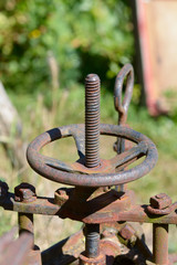Rusty old farm machinery in garden