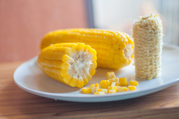 Boiled corn on white bowl