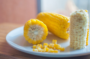 Boiled corn on white bowl