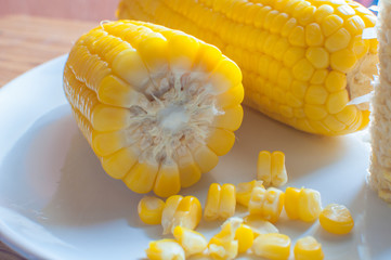 Boiled corn on white bowl