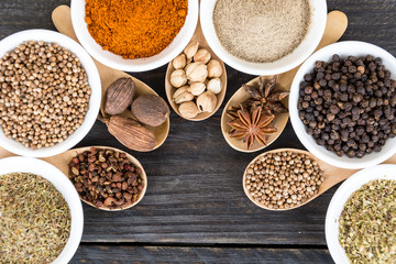 Spices and herbs in  bowls.