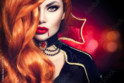 Halloween vampire woman portrait. Beautiful glamour fashion sexy vampire