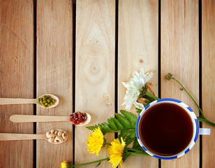 Obraz na płótnie Canvas A cup of tea with flowers and tea around it