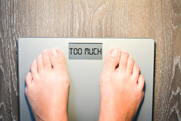 Lose weight concept with person on a scale measuring kilograms