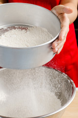 Sifting flour into the bowl,food ingredient,prepare for cooking or baking