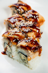 traditional fresh japanese sushi rolls on a white background