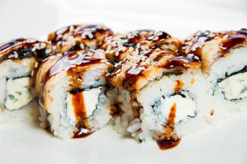 traditional fresh japanese sushi rolls on a white background