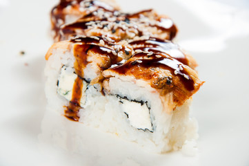 traditional fresh japanese sushi rolls on a white background