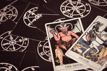 The Tarot - Card of Death and Devil On Black Background.