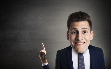 Funny businessman indicating with little arm e big head on