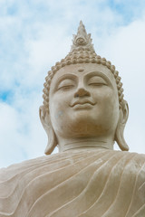 Buddha status on blue sky background