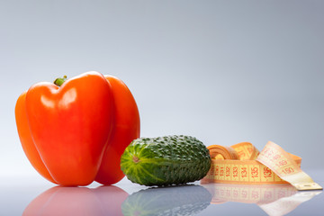 Fresh colored vegetables with centimeter measuring your health